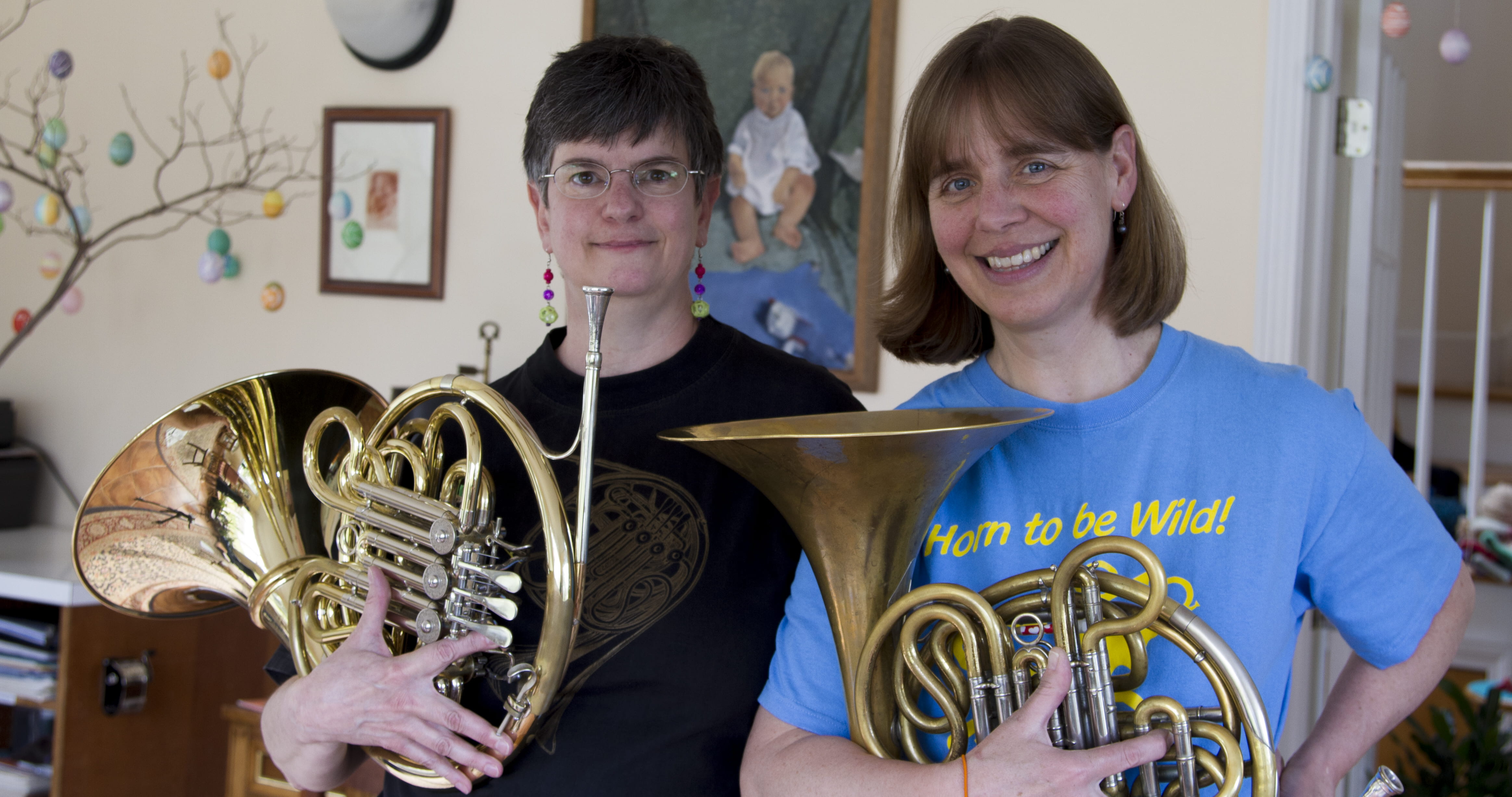 Portrait photo of two French horn players